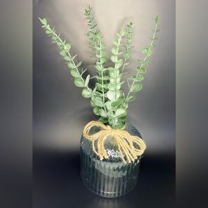 Faux Eucalyptus Centerpiece in a Blue Tinted Textured Vase with Burlap Bow